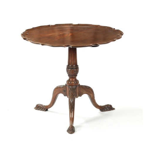 1505 - AN EARLY 19TH CENTURY MAHOGANY TILT TOP TABLE with shaped flamed pie crust top; raised on an elabora... 