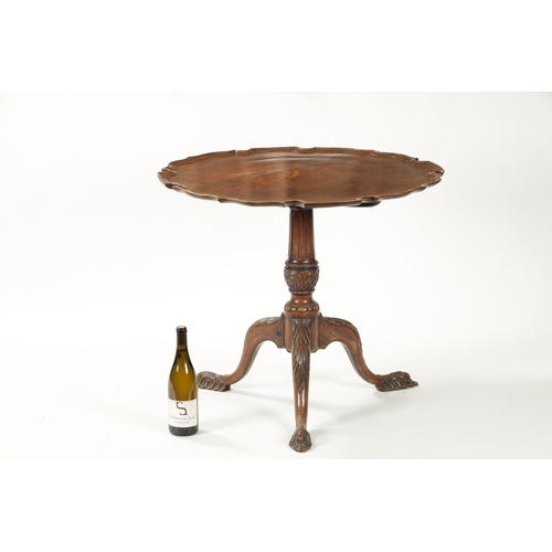 1505 - AN EARLY 19TH CENTURY MAHOGANY TILT TOP TABLE with shaped flamed pie crust top; raised on an elabora... 