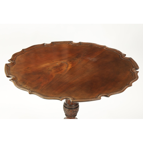 1505 - AN EARLY 19TH CENTURY MAHOGANY TILT TOP TABLE with shaped flamed pie crust top; raised on an elabora... 