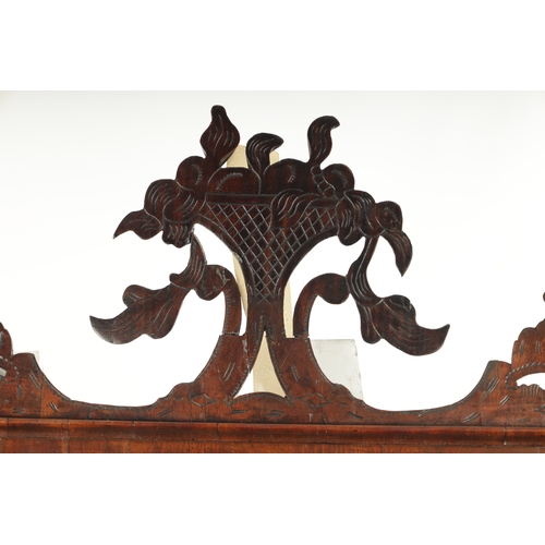 4 - A LARGE MID 18TH CENTURY WALNUT HANGING MIRROR with fret-cut shaped surround enclosing a rectangular... 