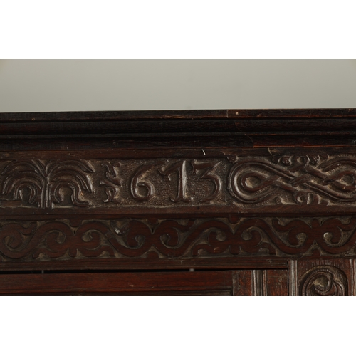 71 - A GOOD LATE 17TH CENTURY OVERSIZED CARVED OAK WESTMORLAND COURT CUPBOARD DATED 1673 having carved fr... 