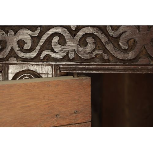 71 - A GOOD LATE 17TH CENTURY OVERSIZED CARVED OAK WESTMORLAND COURT CUPBOARD DATED 1673 having carved fr... 