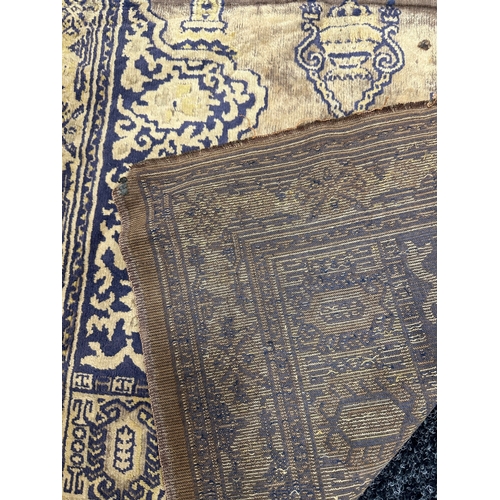 386 - AN ANTIQUE EASTERN PRAYER RUG (108cm wide 60cm deep)