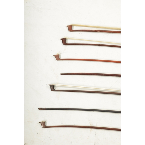 1106 - A COLLECTION OF SEVEN ANTIQUE VIOLIN BOWS one with a bone frog. The broken bow with ebony frog is si... 