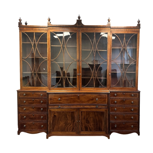 1502 - A FINE GEORGE III SHERATON DESIGN INLAID MAHOGANY BREAKFRONT BOOKCASE with shaped pediment and finia... 