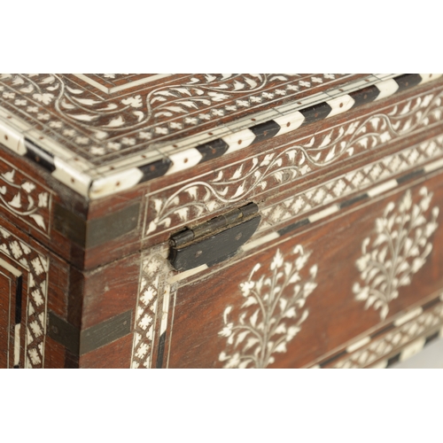 100 - A LARGE LATE 19TH CENTURY ANGLO-INDIAN IVORY AND EBONY INLAID WORKBOX with fine scrolling branch wor... 