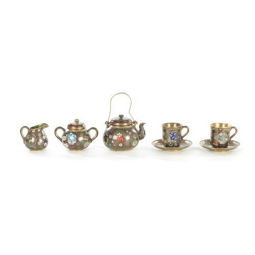110 - A JAPANESE MEIJI PERIOD FIVE-PIECE CLOISONNE TEA SET decorated with floral panels and gilt interiors... 