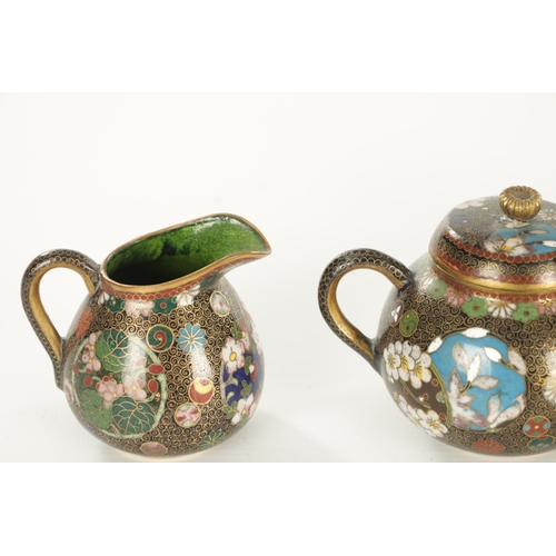 110 - A JAPANESE MEIJI PERIOD FIVE-PIECE CLOISONNE TEA SET decorated with floral panels and gilt interiors... 