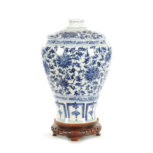 115 - A 19TH CENTURY CHINESE BLUE AND WHITE CHINESE VASE with floral allround decoration; raised on a hard... 