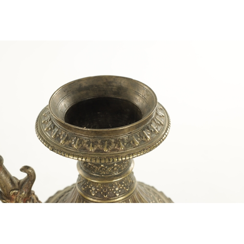 129 - AN EARLY INDIAN ISLAMIC BRONZE HUKA BASE with an elephant-shaped spout and floral decoration (29cm h... 