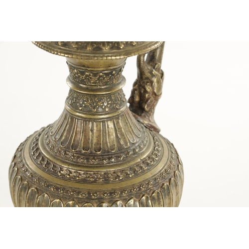 129 - AN EARLY INDIAN ISLAMIC BRONZE HUKA BASE with an elephant-shaped spout and floral decoration (29cm h... 