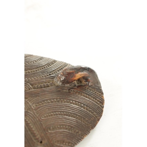 133 - AN EARLY 19TH CENTURY MAORI WAKA HUIA / FEATHER BOX COVER the carved hardwood cover decorated with c... 