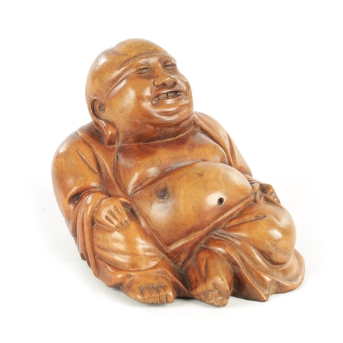 139 - A 19TH CENTURY CHINESE HARDWOOD CARVED SCULPTURE modelled as a seated Buddha (11cm high )