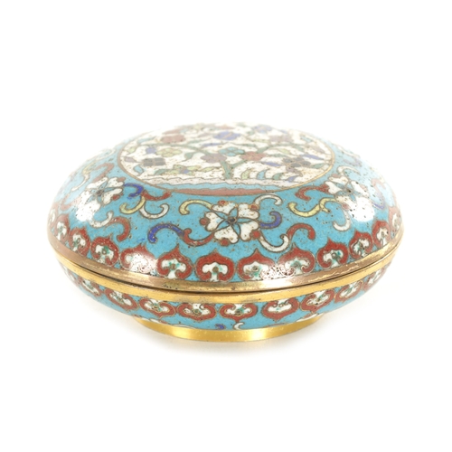 147 - A CHINESE CLOISONNE ENAMEL CIRCULAR LIDDED BOX with finely decorated coloured enamels depicting a bu... 