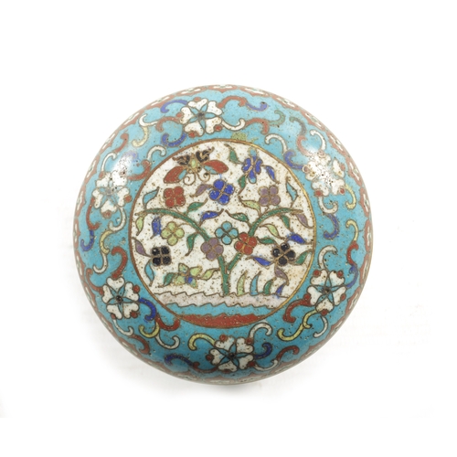 147 - A CHINESE CLOISONNE ENAMEL CIRCULAR LIDDED BOX with finely decorated coloured enamels depicting a bu... 