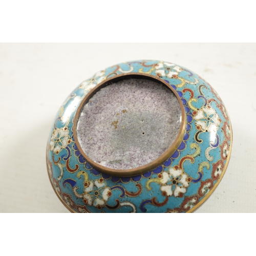 147 - A CHINESE CLOISONNE ENAMEL CIRCULAR LIDDED BOX with finely decorated coloured enamels depicting a bu... 