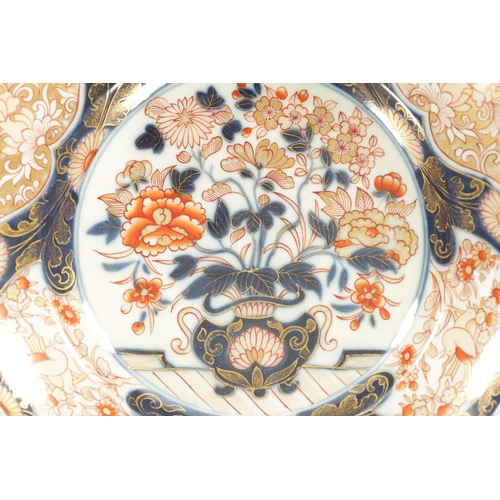 153 - A FINE PAIR OF 18TH CENTURY JAPANESE IMARI DISHES decorated with floral designs decorated in gilt-hi... 