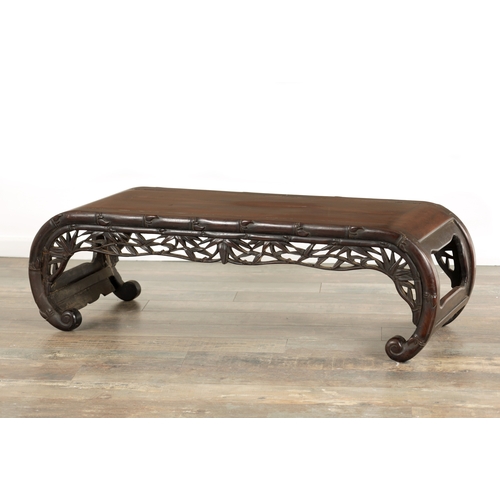 154 - A 19TH CENTURY CHINESE CARVED HARDWOOD ALTAR TABLE with faux bamboo carved front and scrolled sides.... 