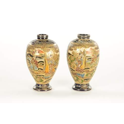 156 - A LARGE PAIR OF JAPANESE SATSUMA VASES decorated with figures, having gilt highlights on a blue grou... 