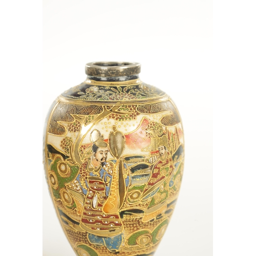 156 - A LARGE PAIR OF JAPANESE SATSUMA VASES decorated with figures, having gilt highlights on a blue grou... 