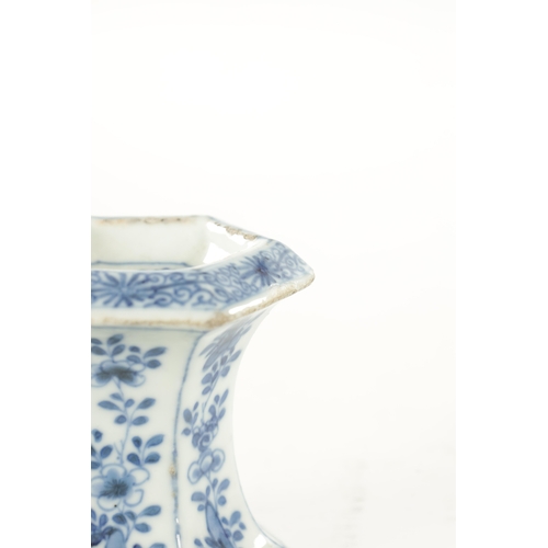 162 - AN 18TH CENTURY CHINESE KANGXI BLUE AND WHITE HEXAGONAL PORCELAIN TABLE SALT decorated with flowers ... 