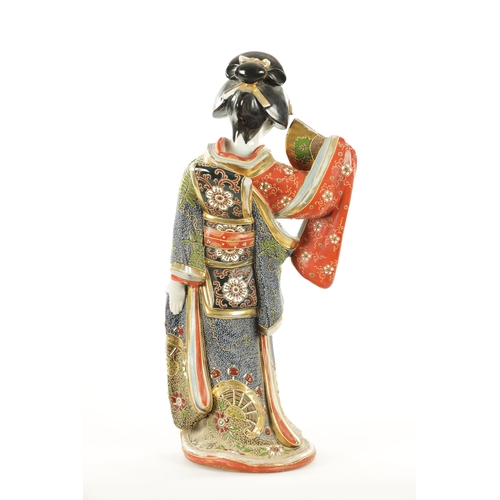 163 - A LATE 19TH CENTURY CHINESE HARDSTONE FIGURE OF A GEISHA the standing young lady begowned in gilt an... 