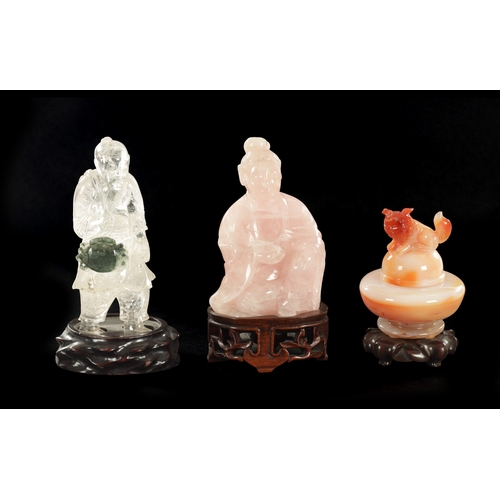 168 - A COLLECTION OF THREE CHINESE HARDSTONE SCULPTURES modelled as an agate Koro and cover on hardwood b... 