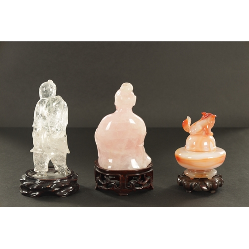 168 - A COLLECTION OF THREE CHINESE HARDSTONE SCULPTURES modelled as an agate Koro and cover on hardwood b... 