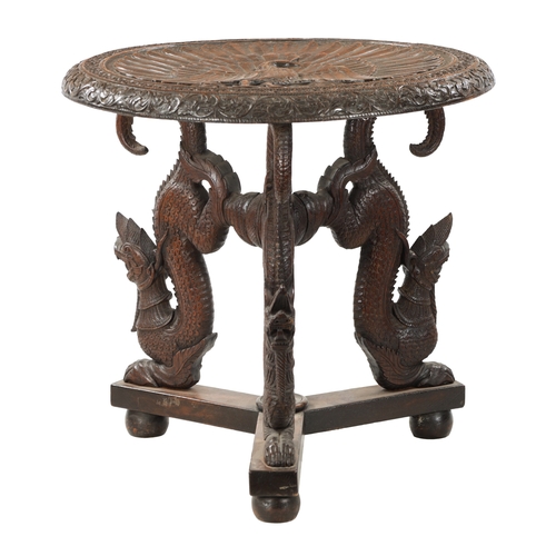 178 - A 19TH CENTURY INDIAN HARDWOOD OCCASIONAL TABLE the circular top with carved scrollwork border enclo... 
