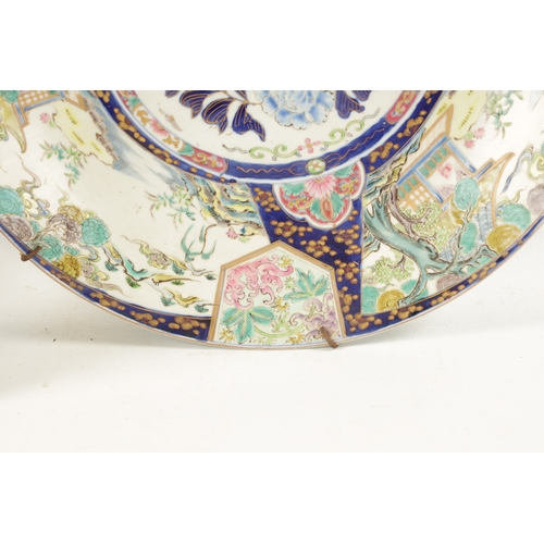 181 - A JAPANESE MEIJI PERIOD PORCELAIN CHARGER with landscape panels to the border surrounding a floral c... 