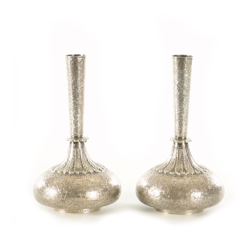 184 - A PAIR OF 19TH CENTURY INDIAN KASHMIR SILVER VASES finely engraved with grapevines, having squat bul... 