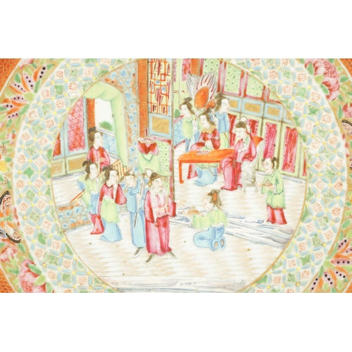 192 - A 19TH CENTURY CHINESE FAMILLE ROSE CHARGER decorated with an interior scene to the centre surrounde... 