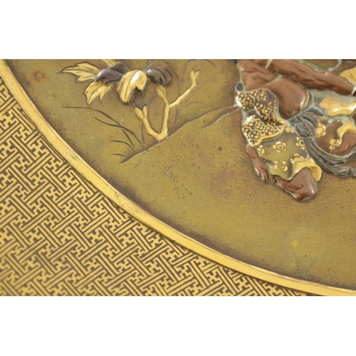 197 - A JAPANESE MEIJI PERIOD CIRCULAR BRONZE AND MIXED METAL INLAID PLATE decorated with figures and a lo... 