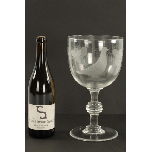 2 - AN OVERSIZED 19TH CENTURY GLASS ENGRAVED GOBLET the body decorated with grapevines and pigeon on kno... 