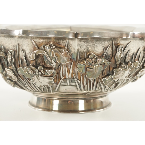 204 - A LARGE JAPANESE MEIJI PERIOD SILVER BOWL shaped a lotus leaf having a floral body and moulded foot ... 