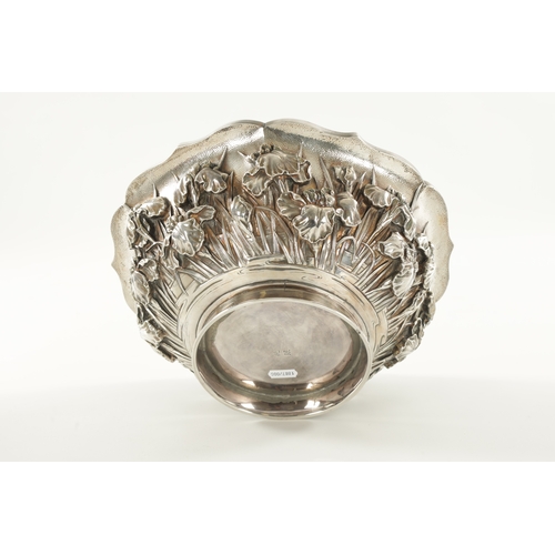 204 - A LARGE JAPANESE MEIJI PERIOD SILVER BOWL shaped a lotus leaf having a floral body and moulded foot ... 