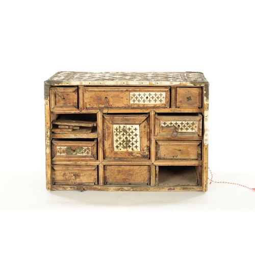 209 - A 17TH CENTURY INDO PORTUGUESE INLAID BONE TABLE CABINET IN NEED OF RESTORATION with all-around peta... 