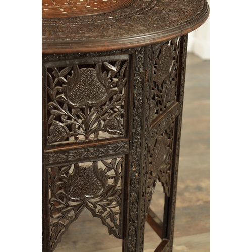 210 - A 19TH CENTURY ANGLO INDIAN CARVED HARDWOOD AND IVORY INLAID OCCASIONAL TABLE with geometric inlaid ... 