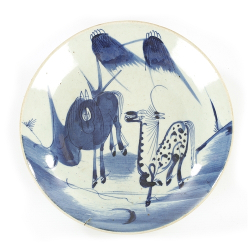 223 - A 19TH CENTURY CHINESE BLUE AND WHITE PORCELAIN PLATE of dished form depicting two horses amongst tr... 