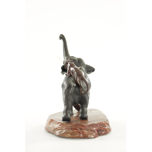 227 - A JAPANESE MEIJI PERIOD BRONZE SCULPTURE OF AN ELEPHANT WITH TIGERS having ivory tusks, signed benea... 