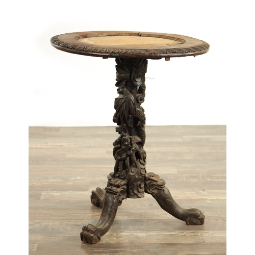 228 - A 19TH CENTURY CHINESE HARDWOOD CENTRE TABLE with leaf carved edge above an entwined dragon and flow... 