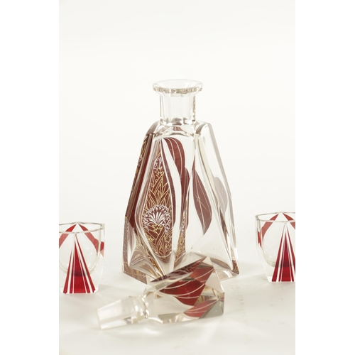 23 - AN ART DECO BOHEMIAN GLASS LIQUER SET of faceted design having six glasses with ruby red overlay, th... 