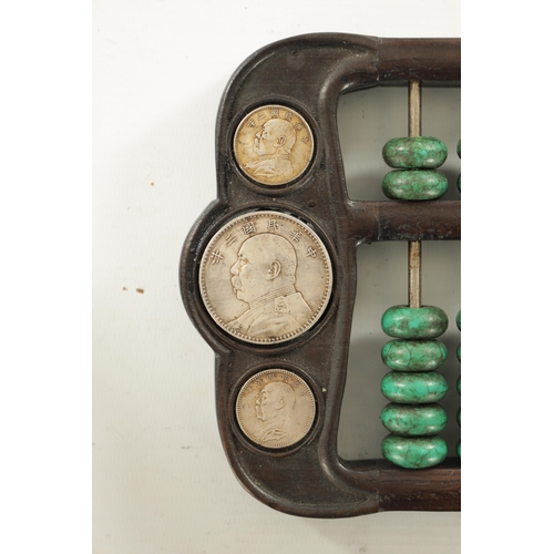 238 - AN ORIENTAL HARDWOOD SET OF GAME COUNTERS with outwork frame and inset coins (41.5cm across)