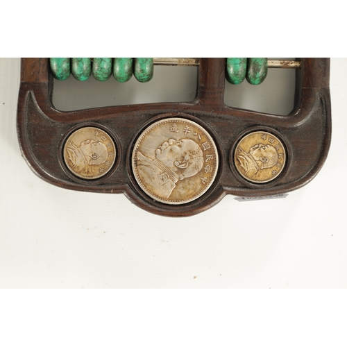 238 - AN ORIENTAL HARDWOOD SET OF GAME COUNTERS with outwork frame and inset coins (41.5cm across)