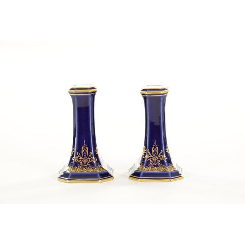 27 - A PAIR OF LATE 19TH CENTURY MEISSEN SPILL VASES of square tapered royal blue and scrolled gilt desig... 