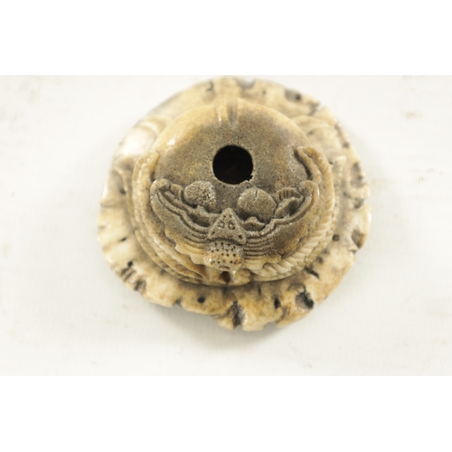 275 - AN 18TH CENTURY CHINESE CARVED STAG HORN BRUSH WASHER with carved bat to the top (6cm diameter)