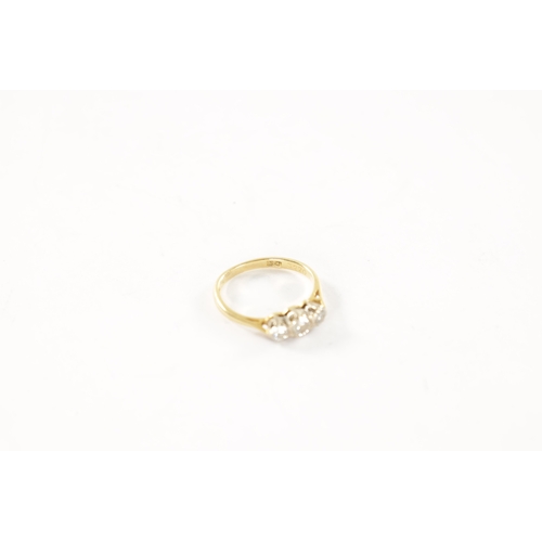 283 - AN 18CT GOLD THREE STONE DIAMOND RING with 1/4 carat centre stone, total weight app. 2.2g. Ring size... 