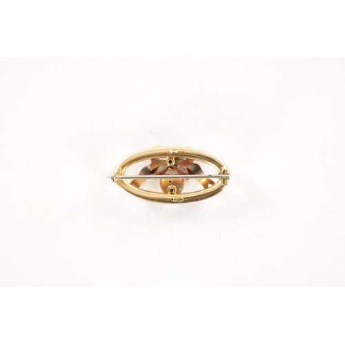 284 - A 15CT GOLD AND DIAMOND OVAL SHAPED SWEETHEART BROOCH the oval frame surrounding a diamond set heart... 