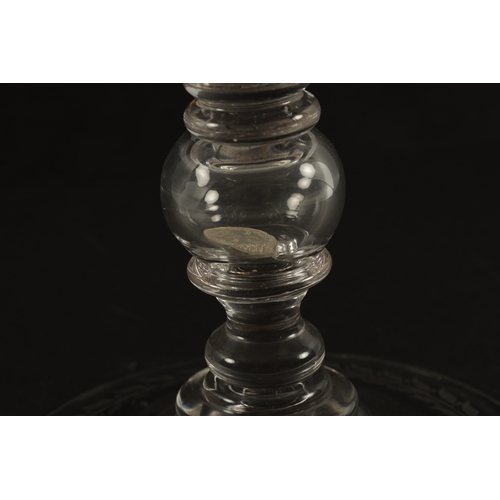3 - AN OVERSIZED LATE 19TH CENTURY ENGRAVED GLASS COIN GOBLET the body having floral decoration and insc... 