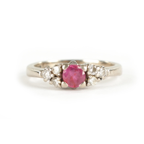 301 - AN 18CT WHITE GOLD DIAMOND AND RUBY RING, total weight app. 4.4g, ring size I/J.